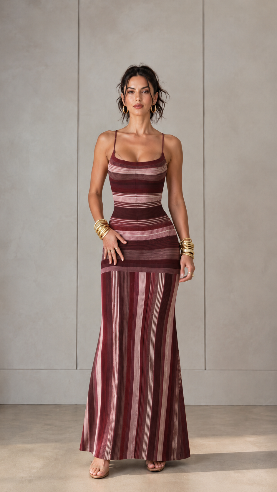 Front view of burgundy striped knit maxi dress with elongated striped design