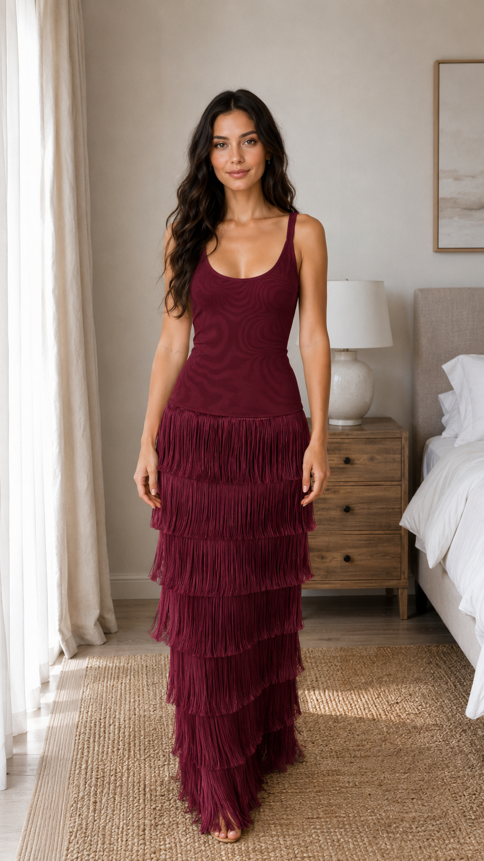 Front view of burgundy sleeveless fringe maxi dress with layered skirt