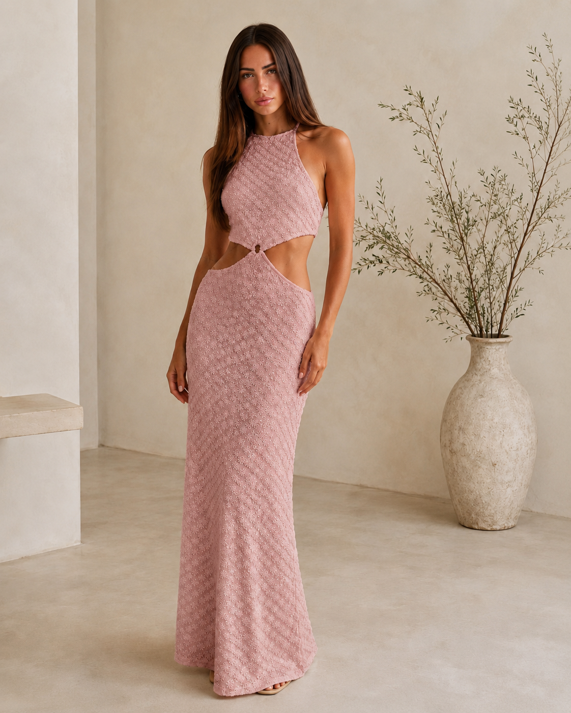 Front view of blush pink textured halter cutout maxi dress