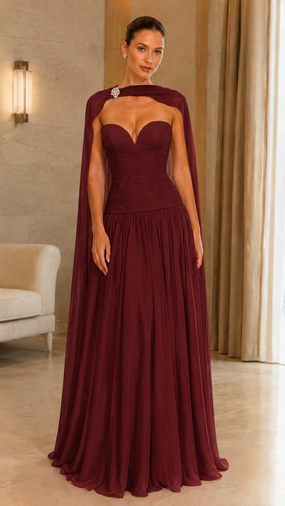 Front view of burgundy sweetheart cape evening gown with full-length skirt