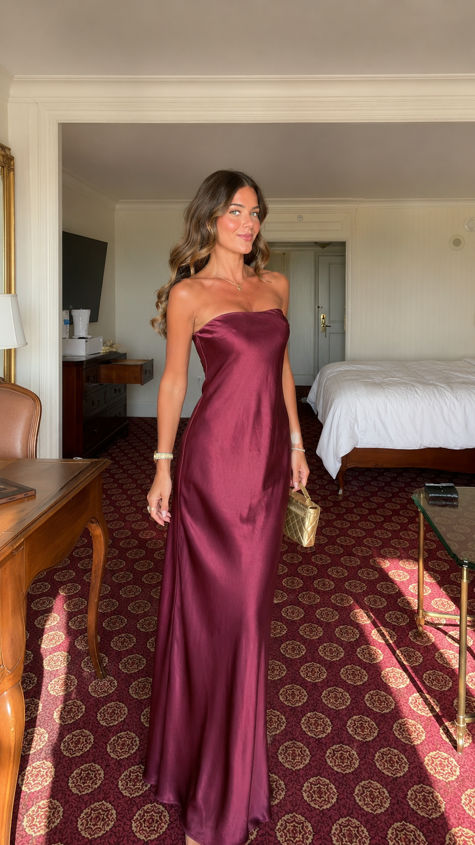 Front view of burgundy strapless satin-look maxi dress