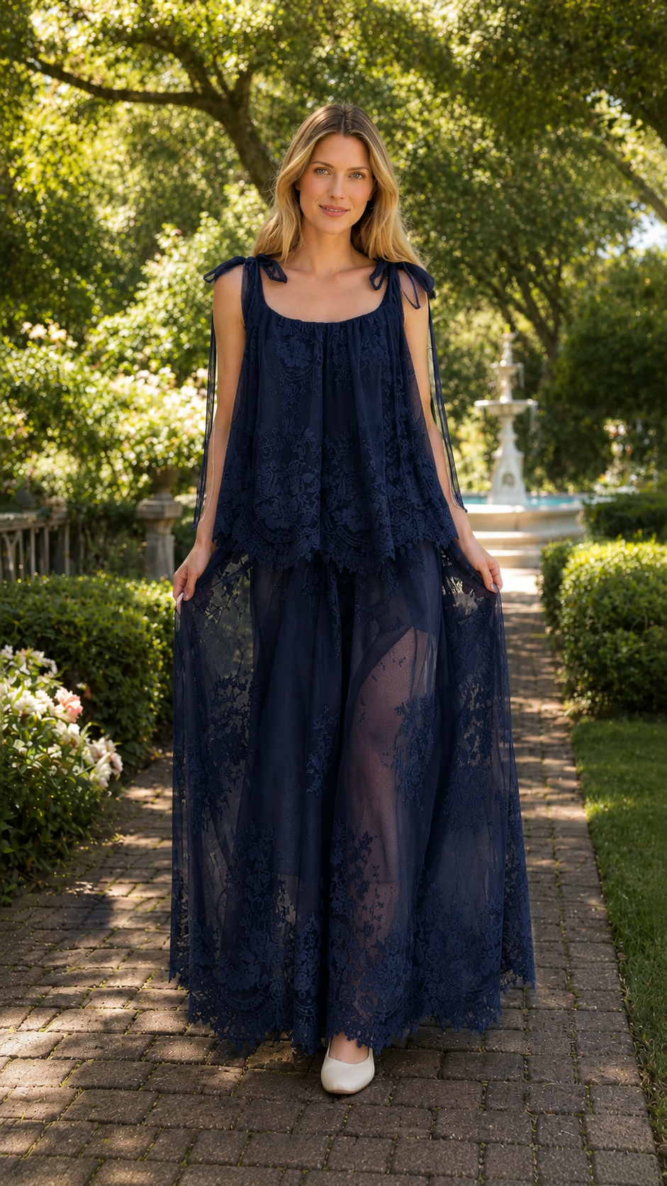 Front view of navy tie-shoulder lace overlay maxi dress